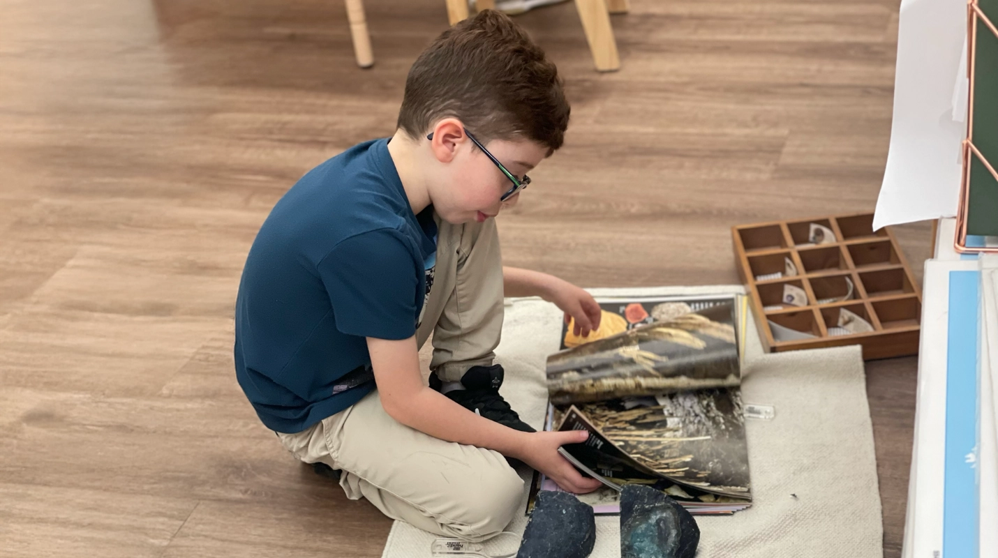 Students engaged in personalized learning activities in a Montessorium classroom